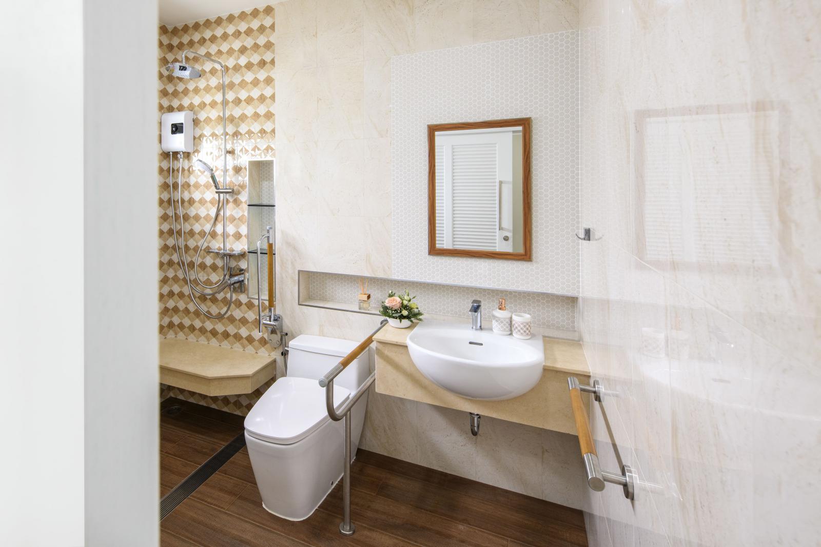 Image of bathroom with grab bars next to toilet and on wall